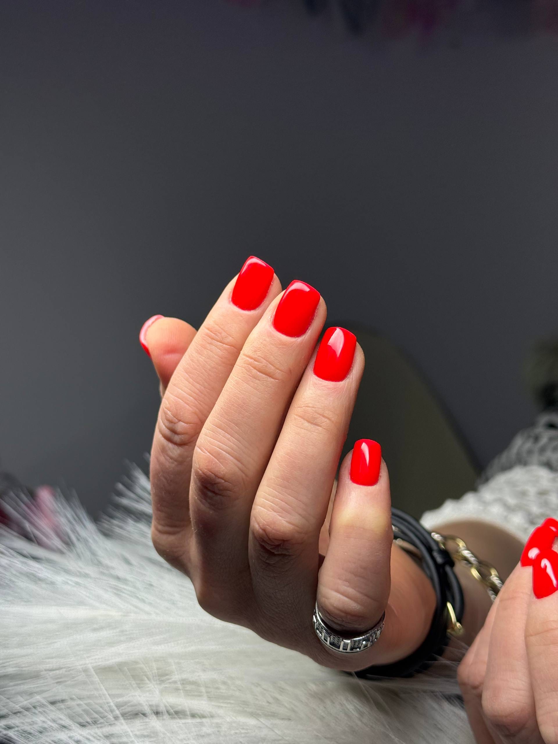 Bright red short square gel manicure